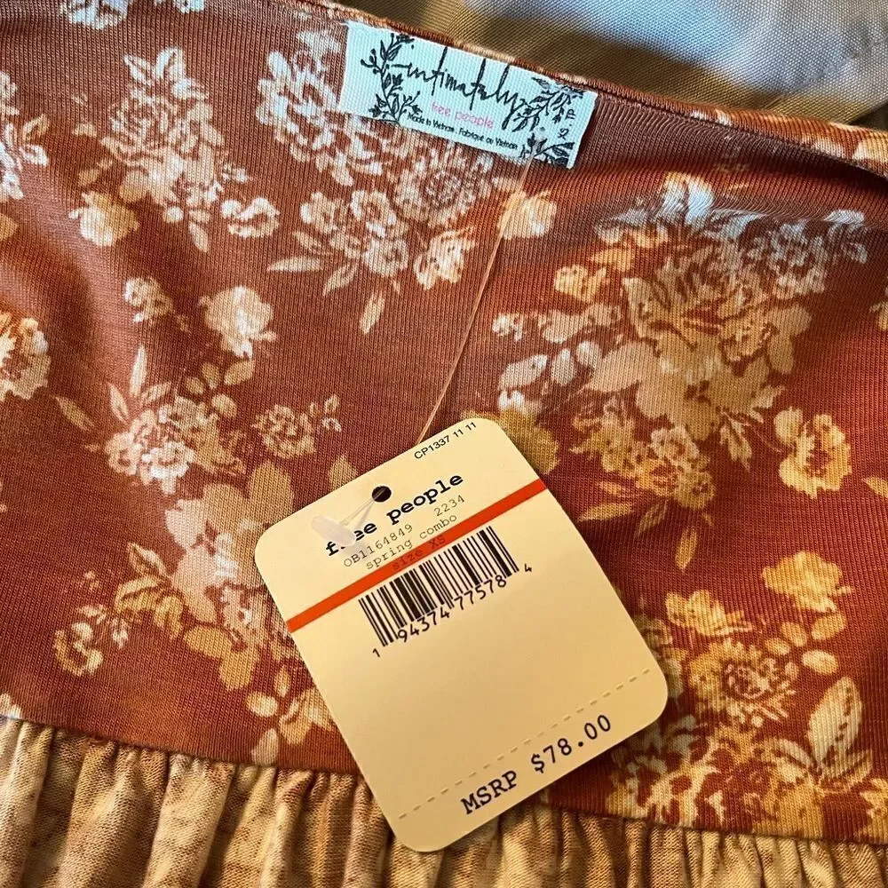 NWT-FREE PEOPLE Turnt Bodysuit